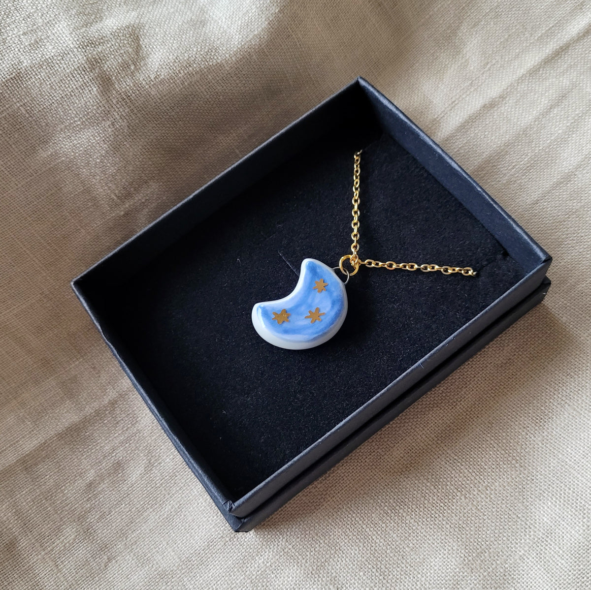 Porcelain necklace with gold "Dark blue moon with gold stars"