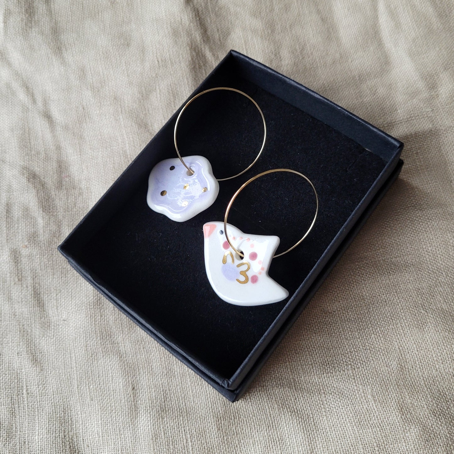 Porcelain dangle earrings with gold "White bird and light purple cloud"