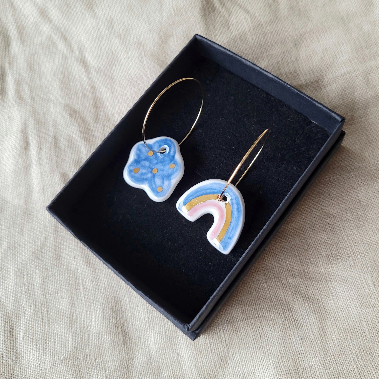 Porcelain dangle earrings with gold "Dark blue cloud and rainbow"