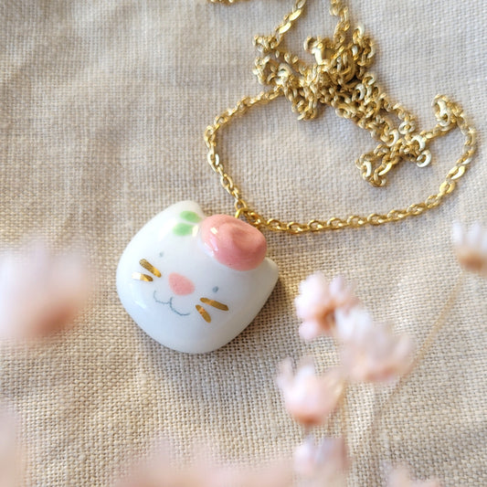 Porcelain necklace with gold "Kitty with pink flower"