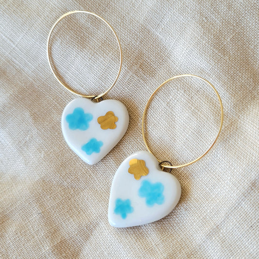 Porcelain dangle earrings with gold "White hearts with light blue clouds"