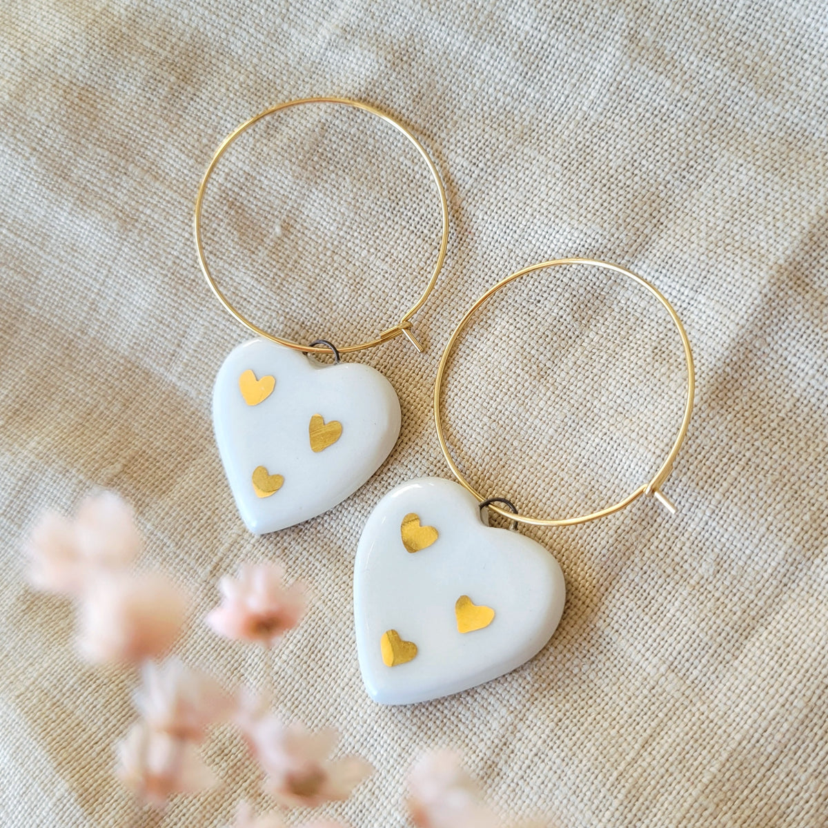 Porcelain dangle earrings with gold "White hearts with little gold hearts"