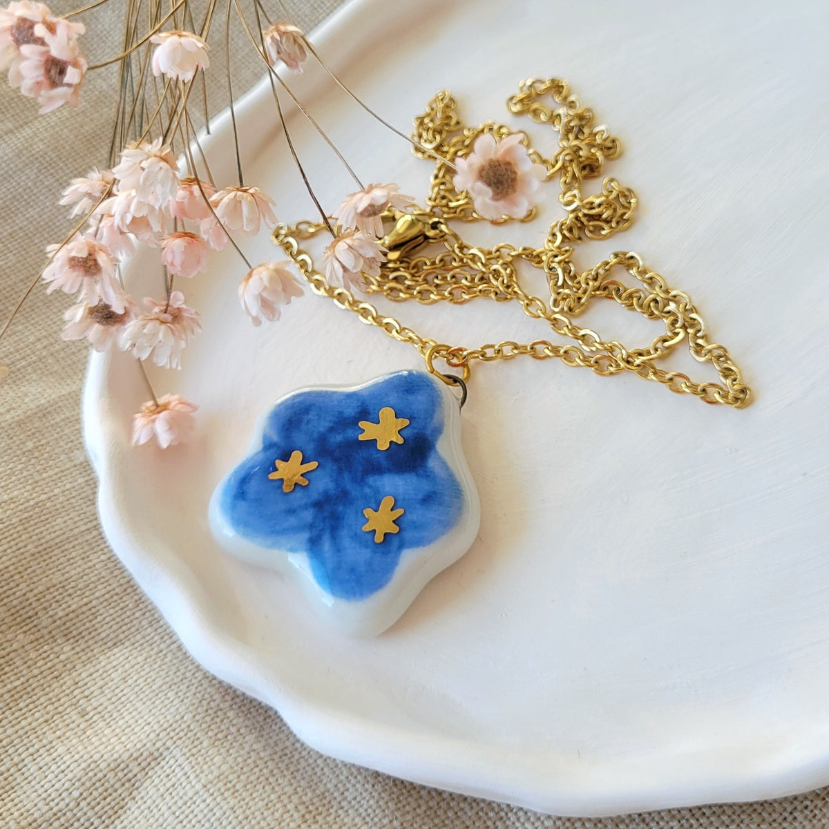 Porcelain necklace with gold "Dark blue cloud with gold stars"