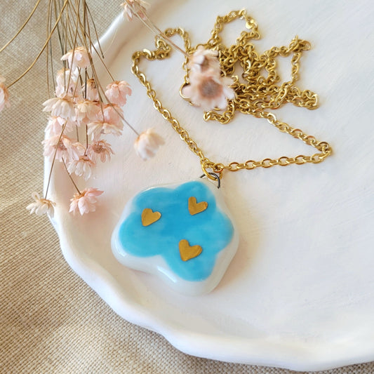 Porcelain necklace with gold "Light blue cloud with gold hearts"