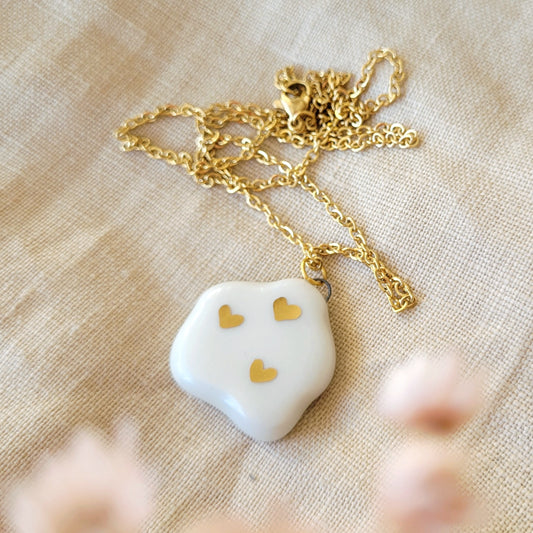 Porcelain necklace with gold "White cloud with gold hearts"