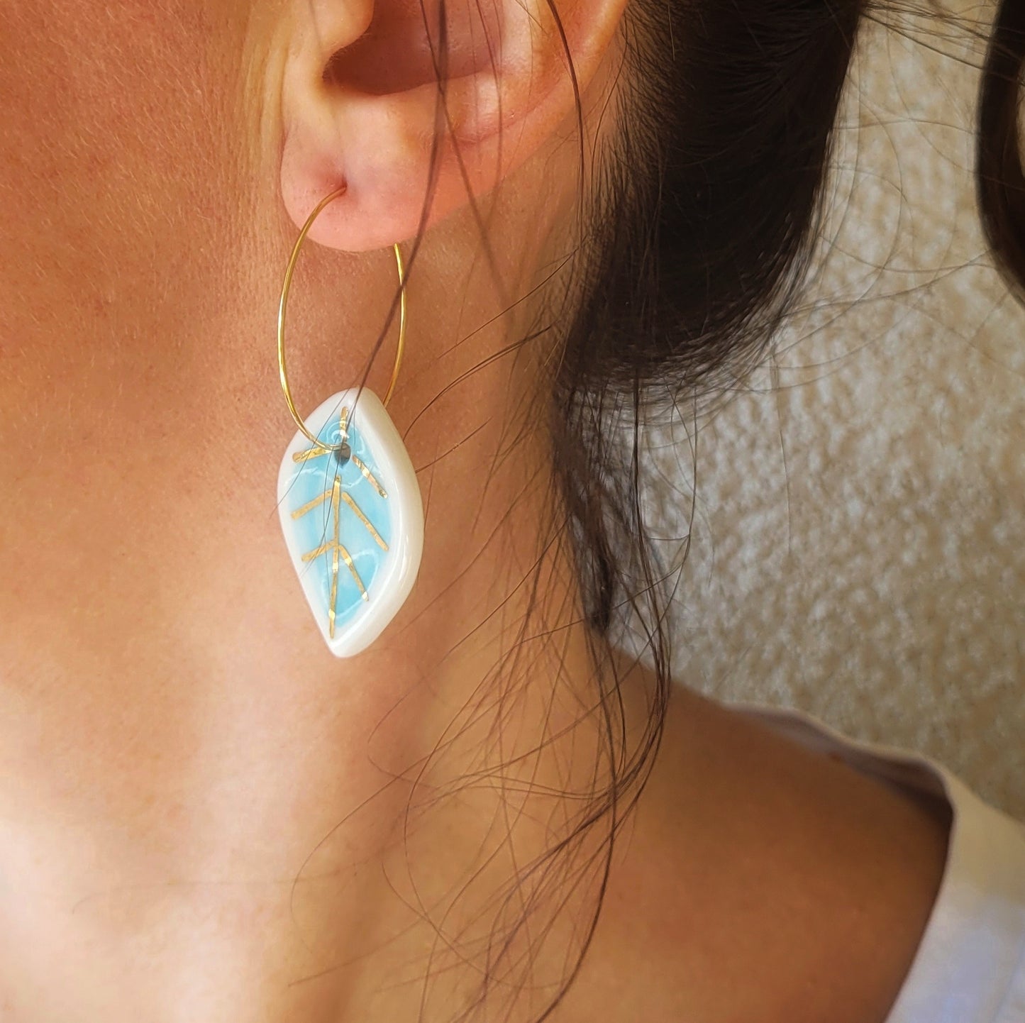 Porcelain dangle earrings with gold "White and light blue leaves"