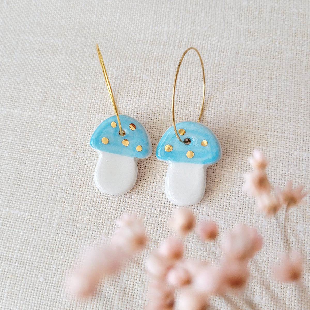 Porcelain dangle earrings with gold "Light blue mushrooms"