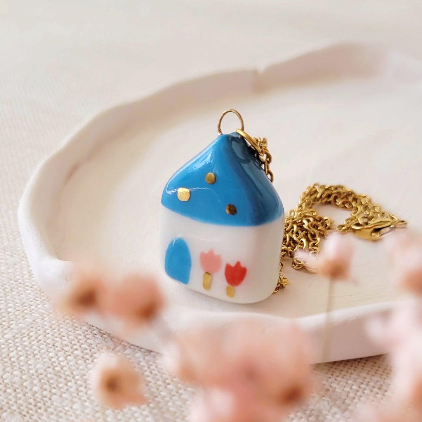 Porcelain necklace with gold "Blue house"