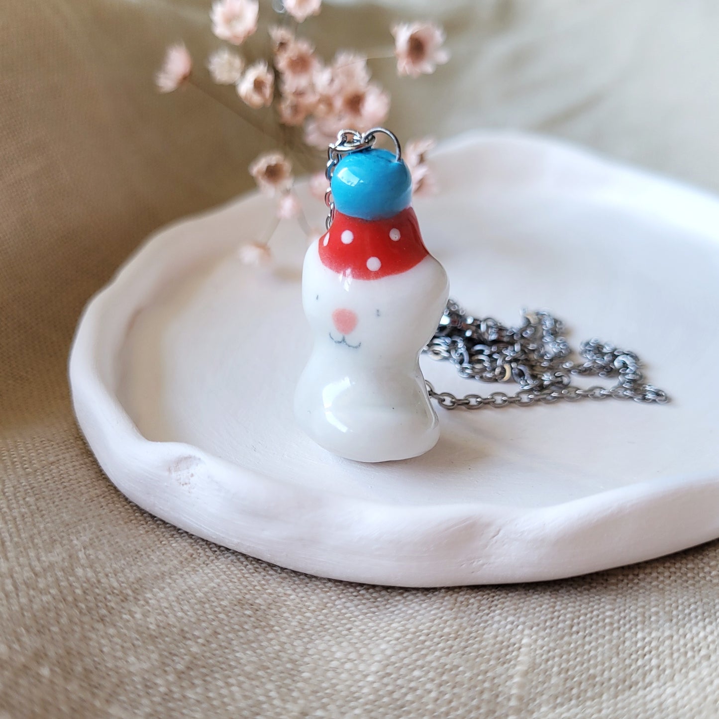 Porcelain necklace "Small party kitty with red hat"