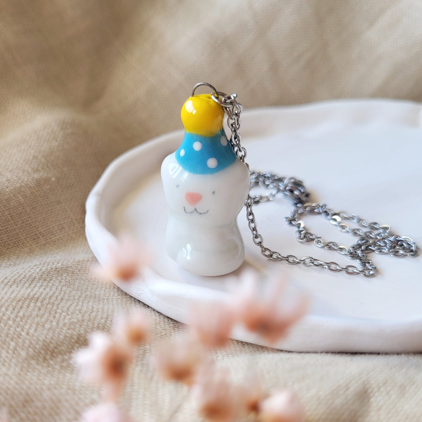 Porcelain necklace "Small party kitty with blue hat"
