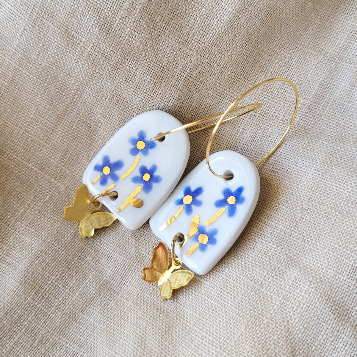 Porcelain dangle earrings with gold "Blue flowers"