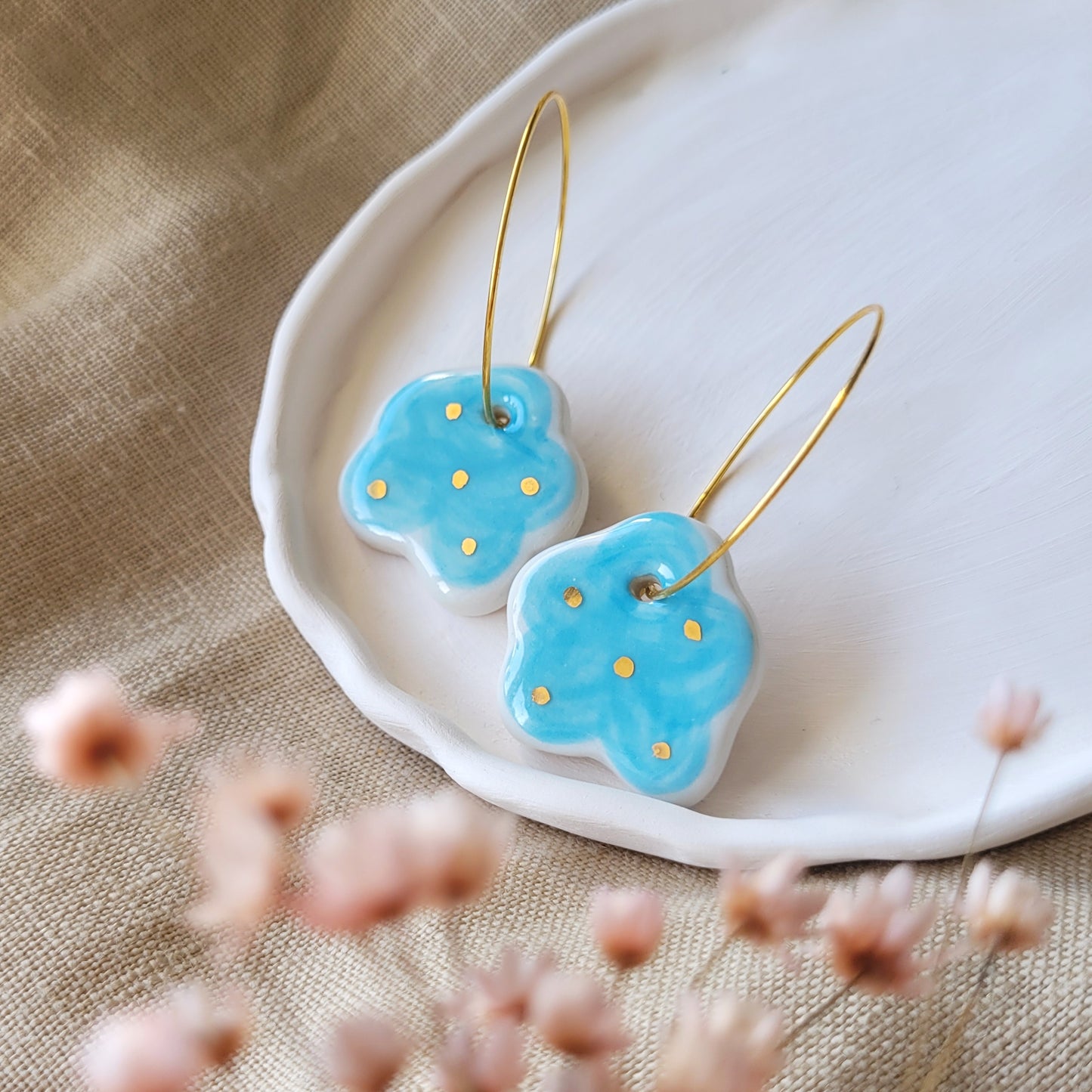 Porcelain dangle earrings with gold "Light blue clouds"