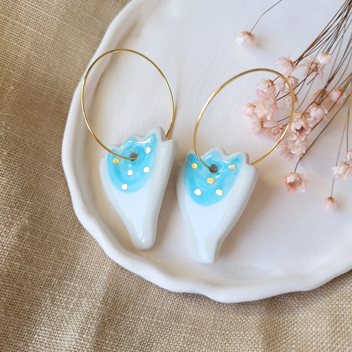 Porcelain dangle earrings with gold "Light blue tulips"