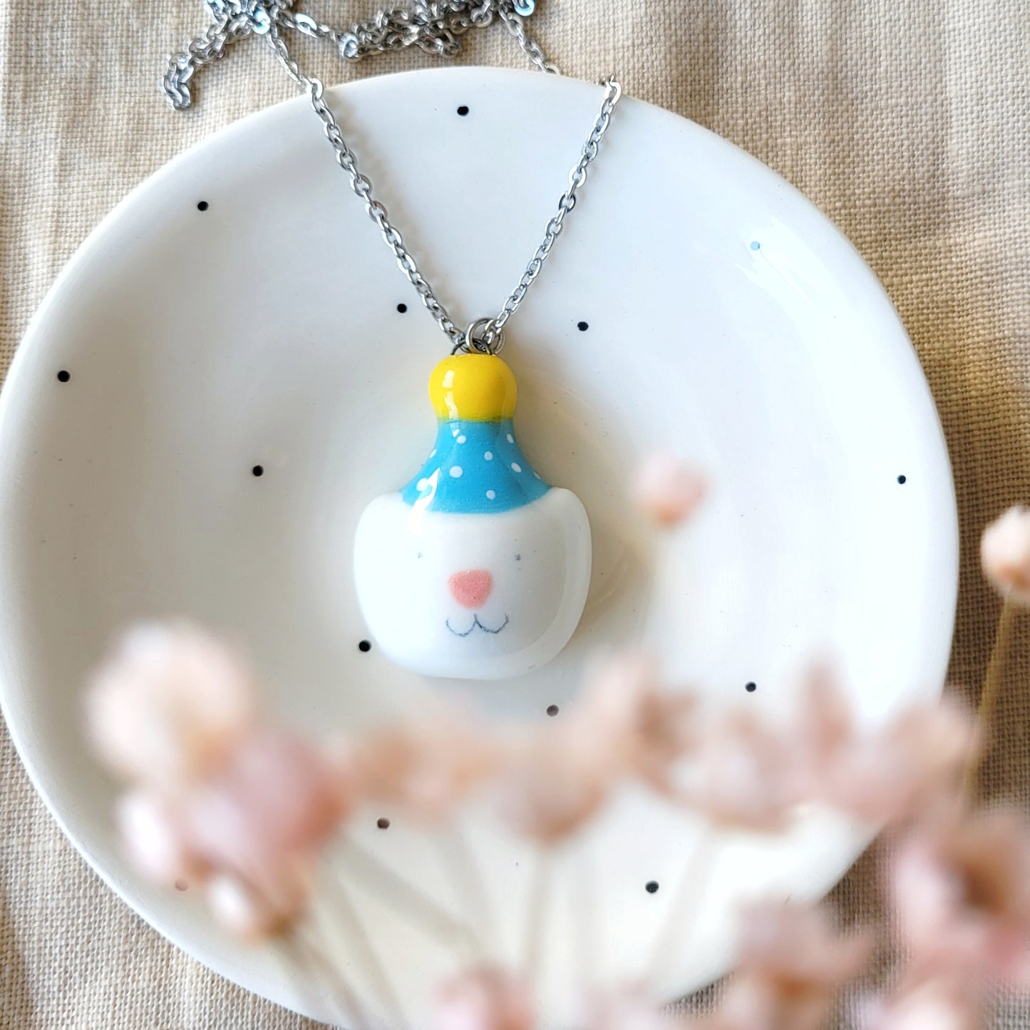 Porcelain necklace "Party kitty with blue hat"