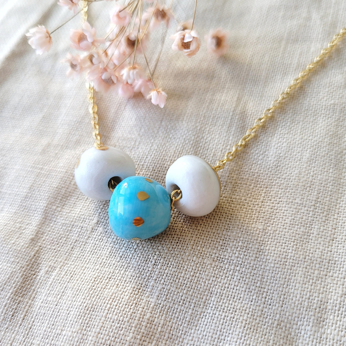 Porcelain necklace with gold "White, gold and blue"