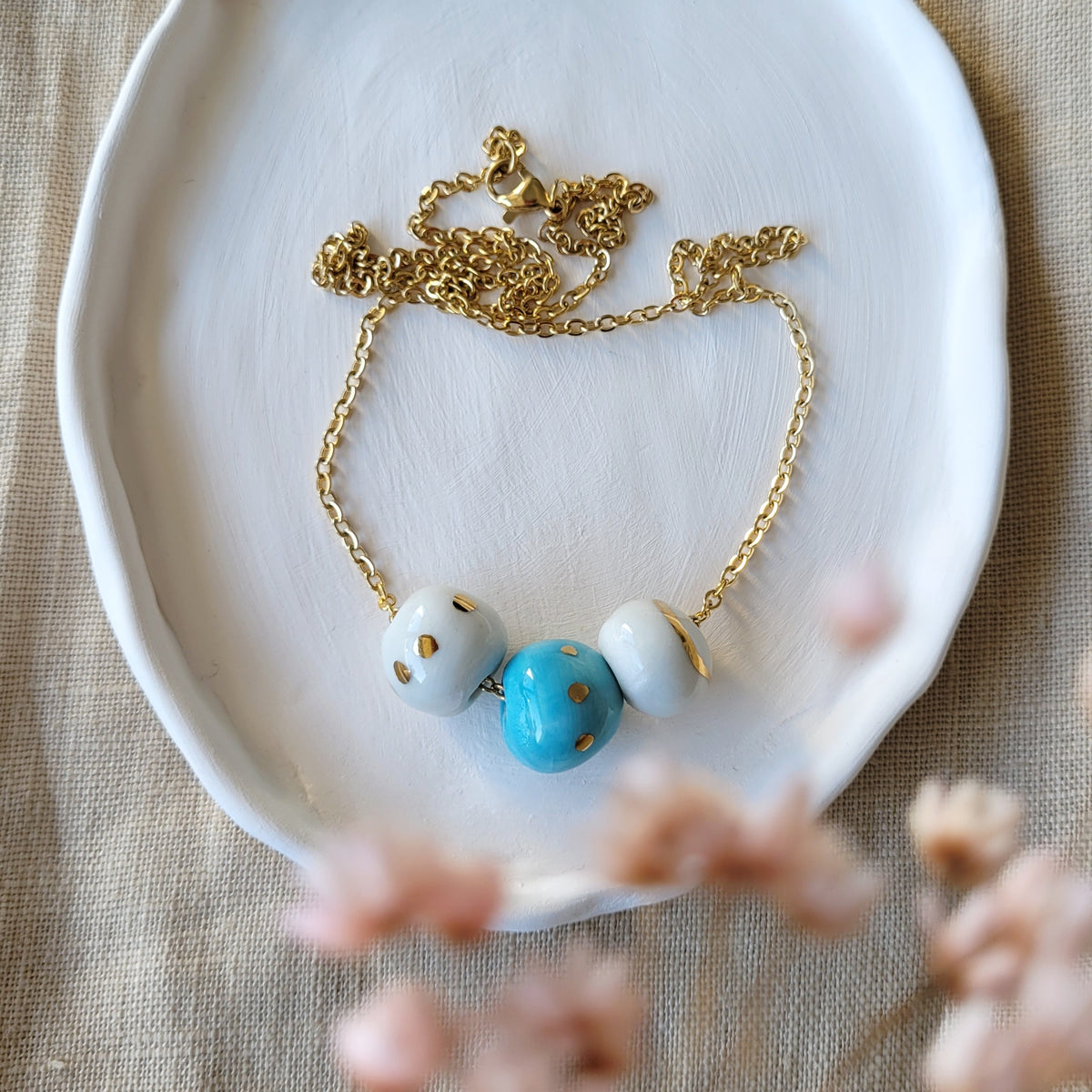 Porcelain necklace with gold "White, gold and blue"