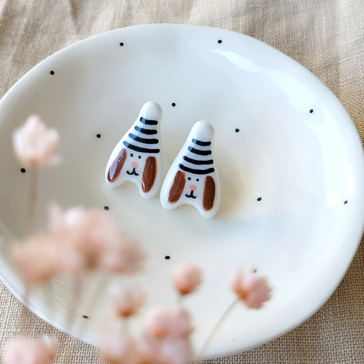 Porcelain stud earrings "Puppies with black and white hats"