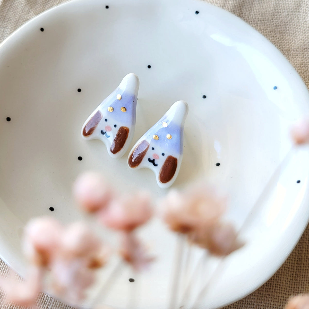 Porcelain stud earrings with gold "Puppies with light purple hats"
