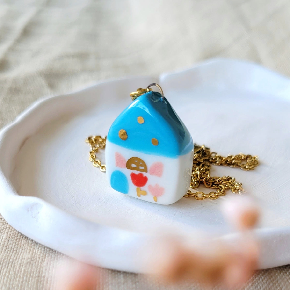 Porcelain necklace with gold "Blue house with red and pink tulip"