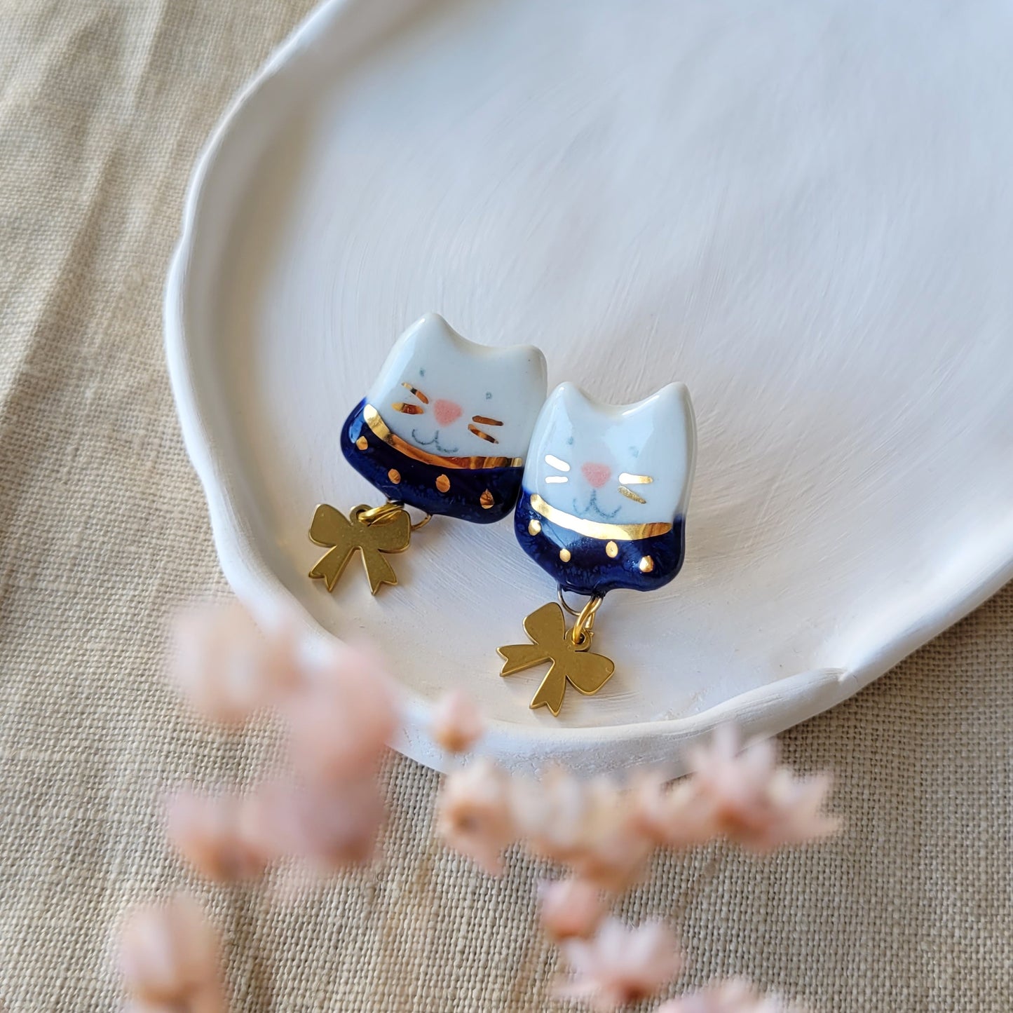 Porcelain stud earrings with gold "Kitties with dark blue collars and bows"