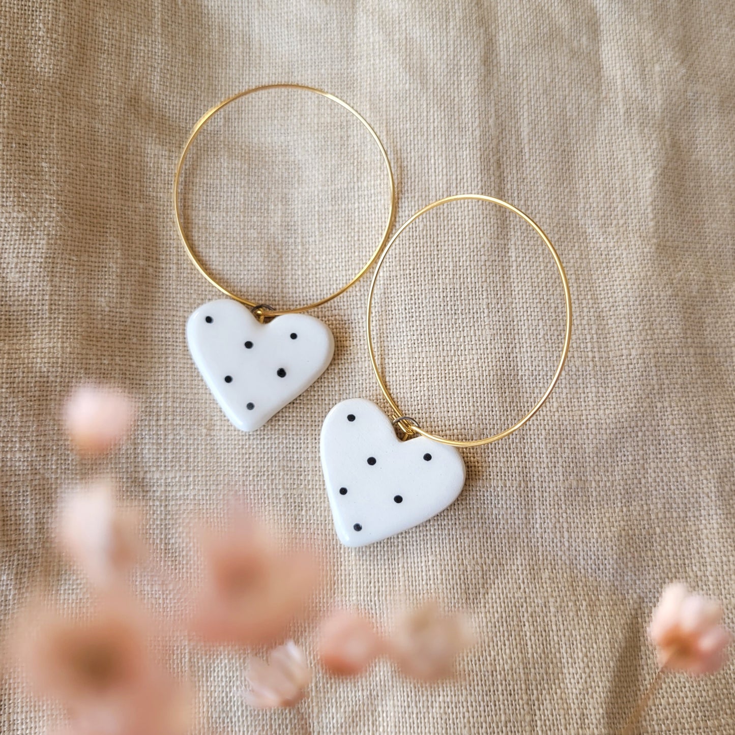 Ceramic dangle earrings "Small white hearts with black dots"