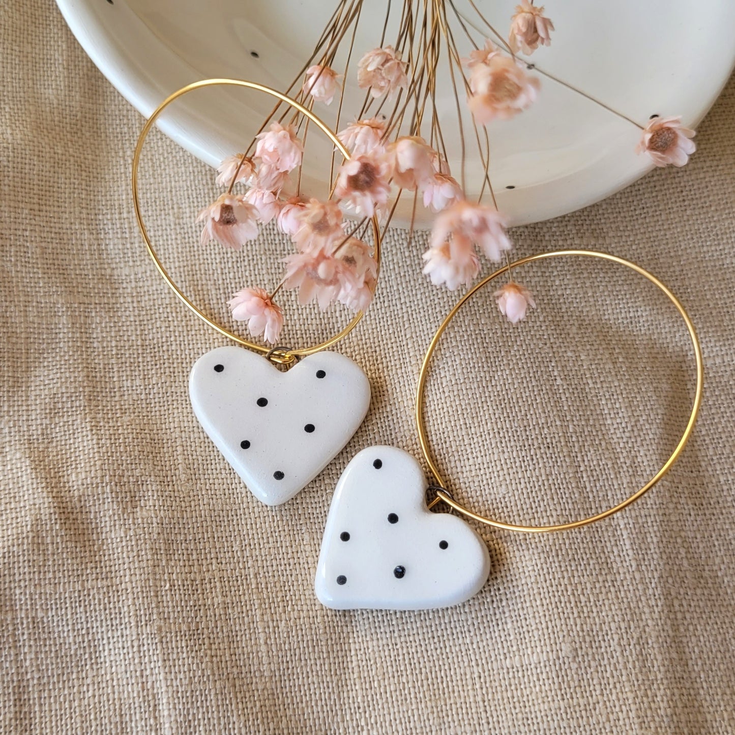 Ceramic dangle earrings "Small white hearts with black dots"