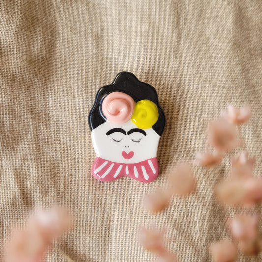 Ceramic brooch "Girl with pink and mustard yellow flowers"