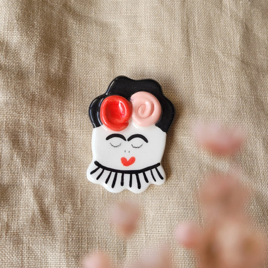 Ceramic brooch "Girl with red and pink flowers"