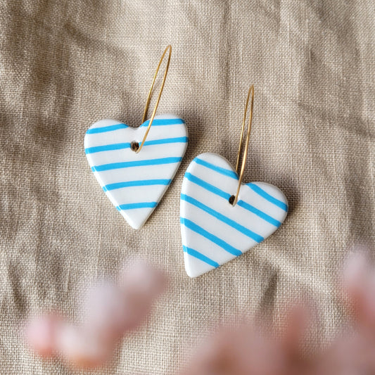 Ceramic dangle earrings "Big white hearts with blue stripes"