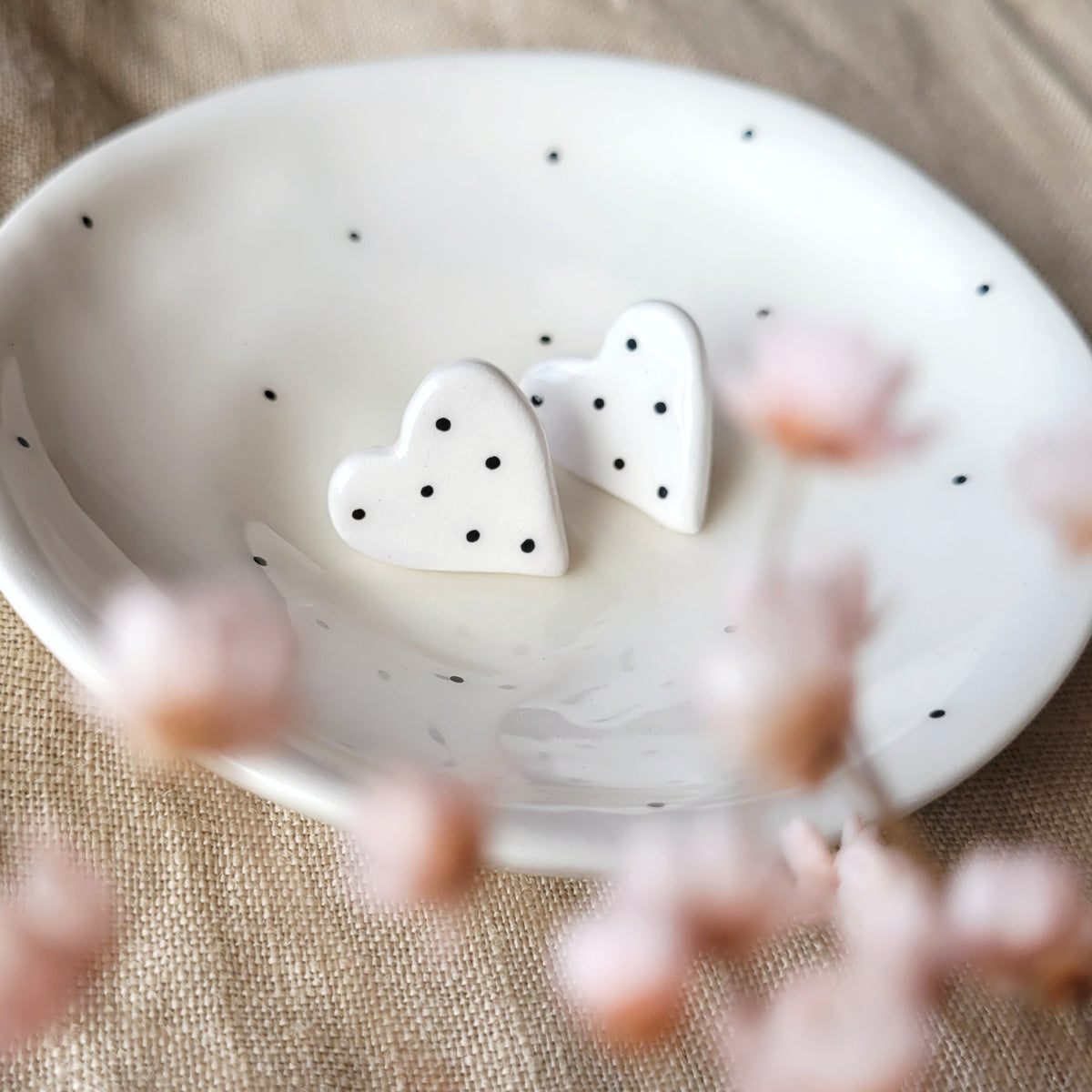 Ceramic stud earrings "White hearts with black dots"