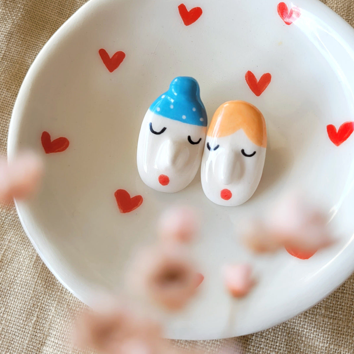 Ceramic mismatched stud earrings "Funny faces and blue hat"