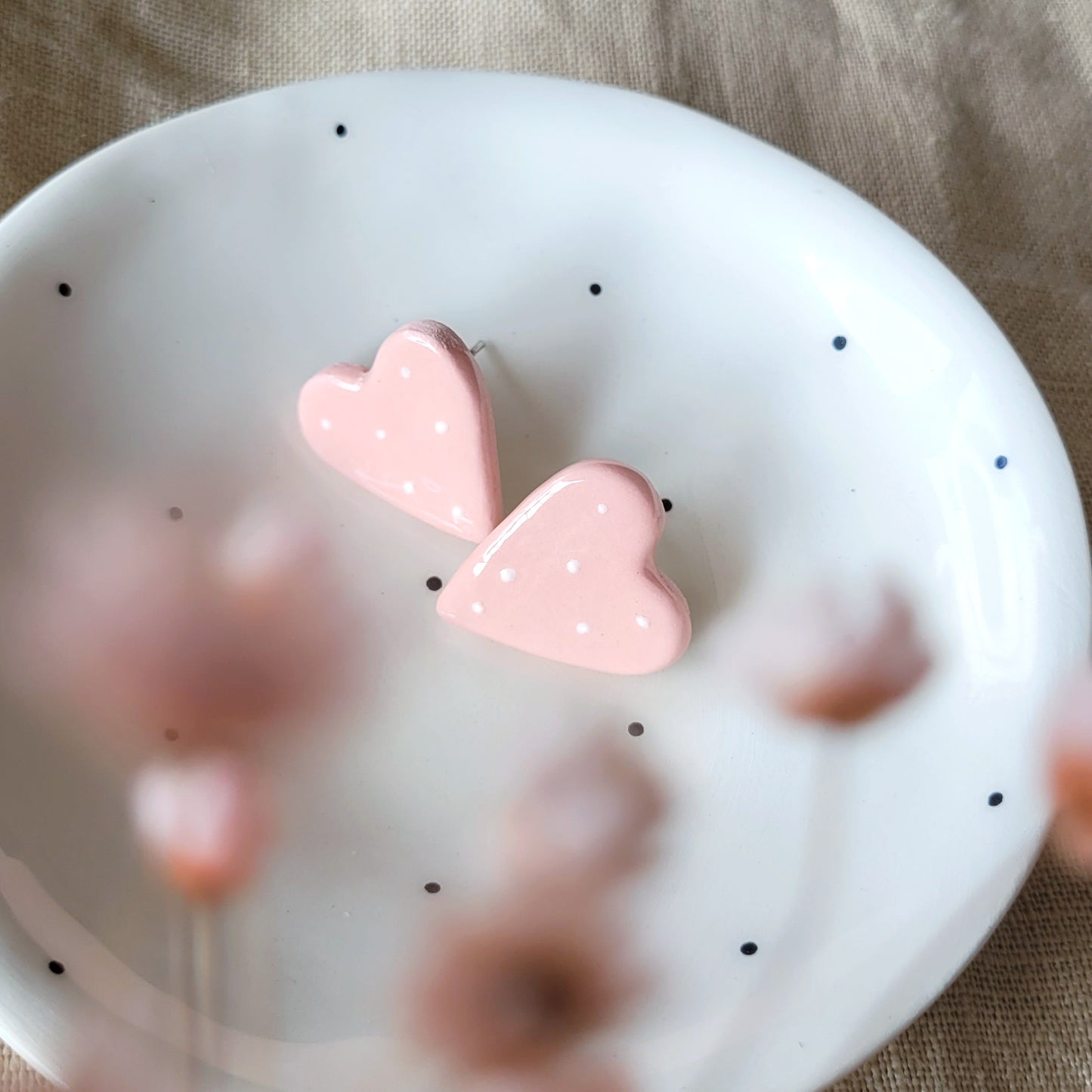 Ceramic stud earrings "Pink hearts with white dots"