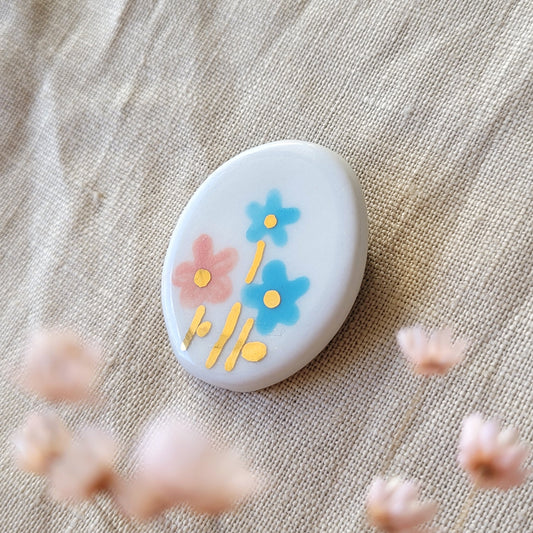 Porcelain brooch with gold "Pink and blue flowers"