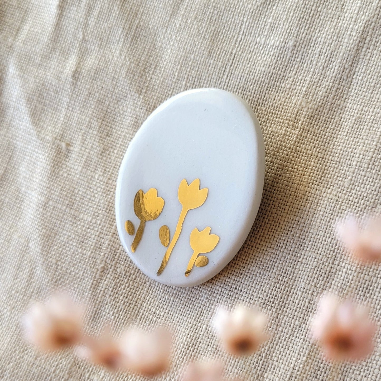 Porcelain brooch with gold "White and gold"
