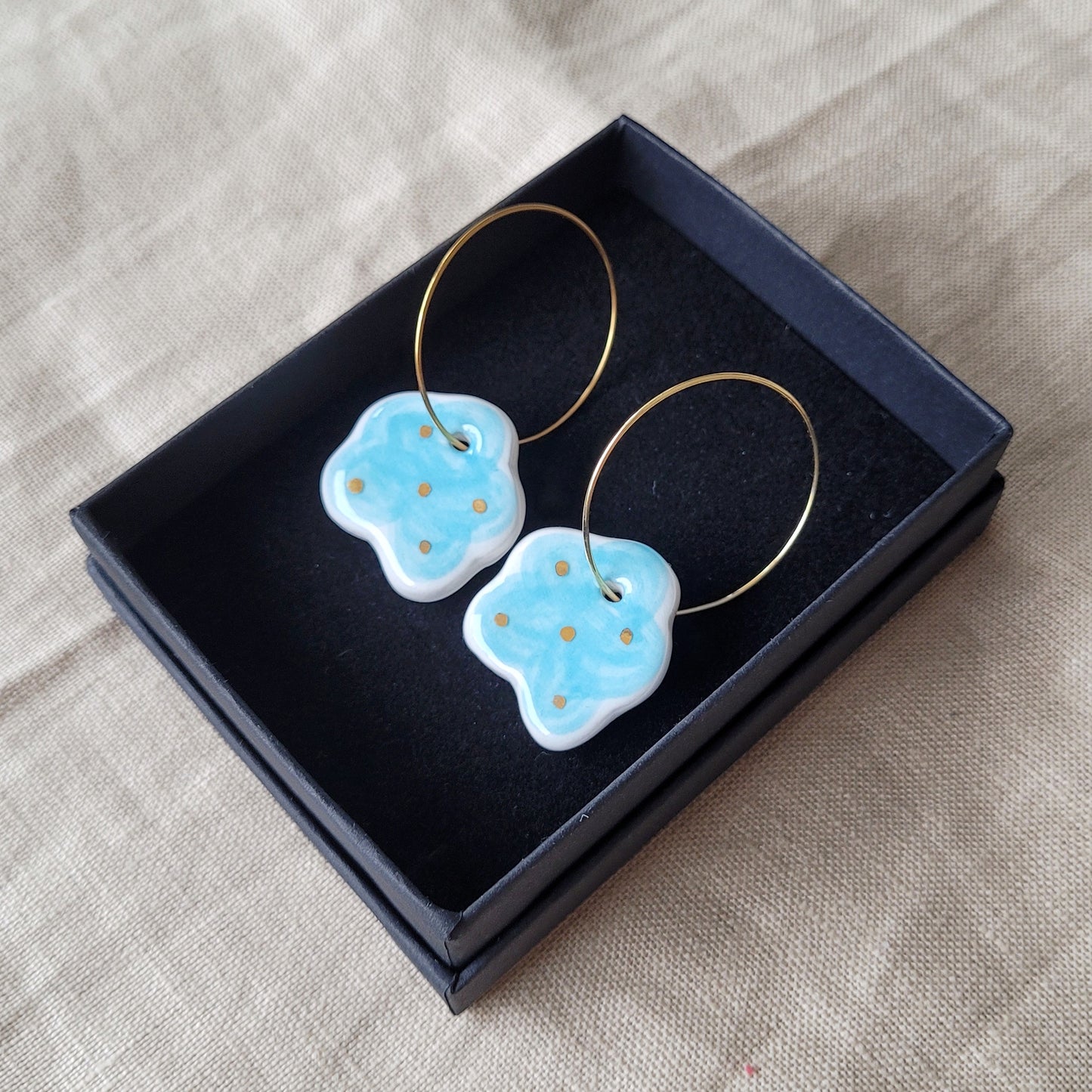 Porcelain dangle earrings with gold "Light blue clouds"