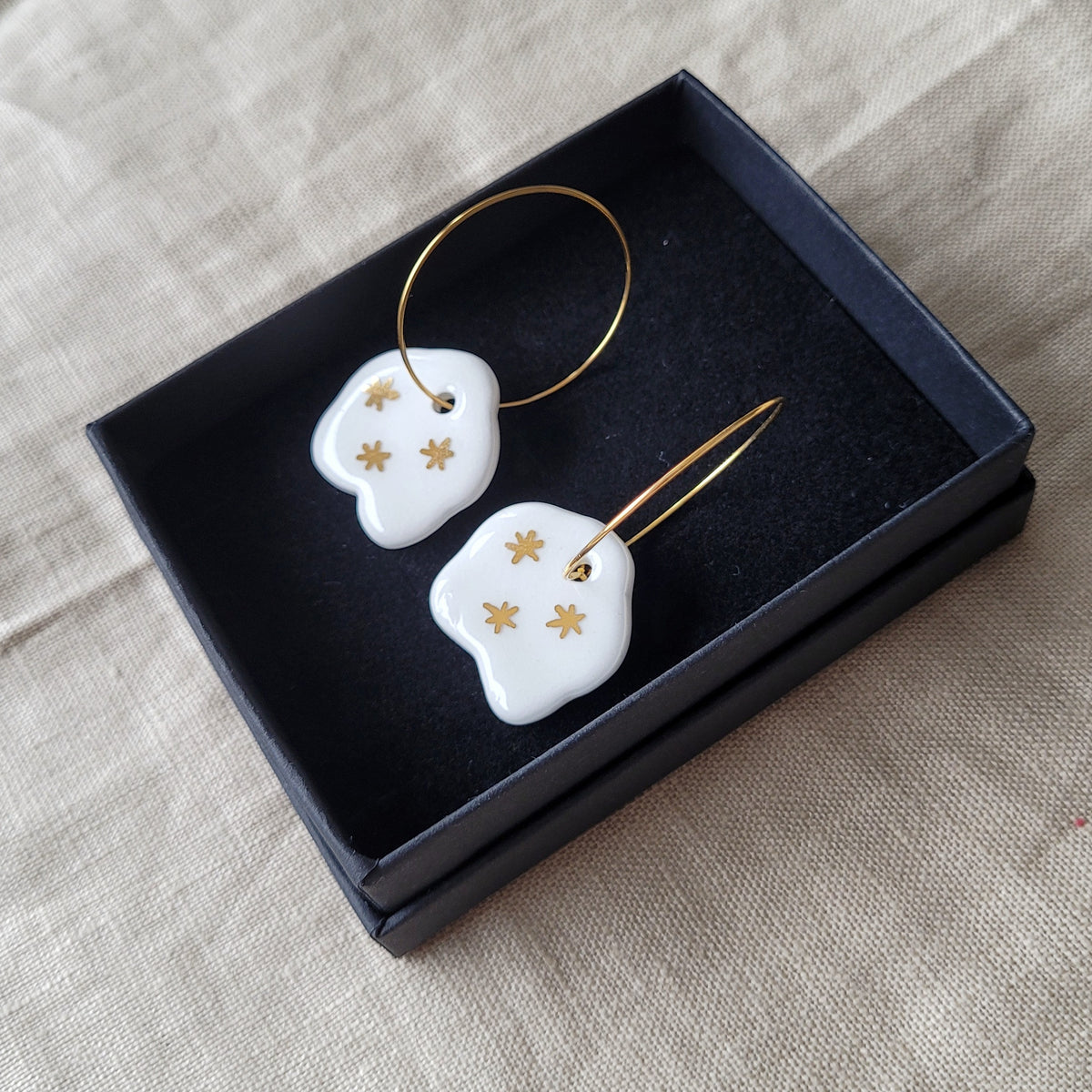 Porcelain dangle earrings with gold "White clouds"