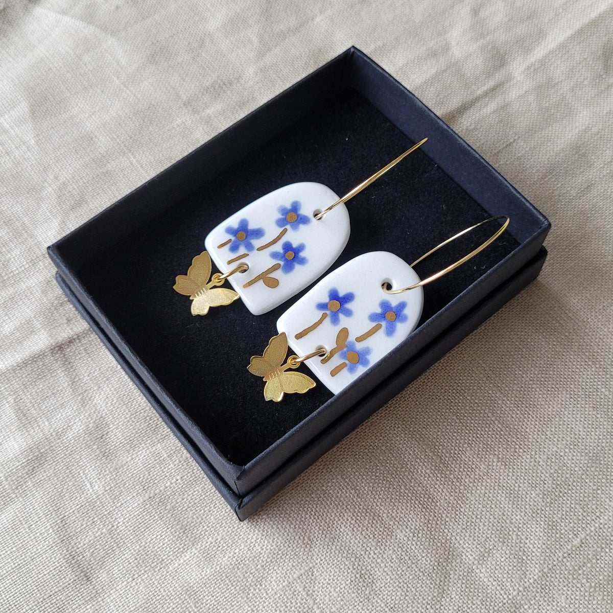 Porcelain dangle earrings with gold "Blue flowers"