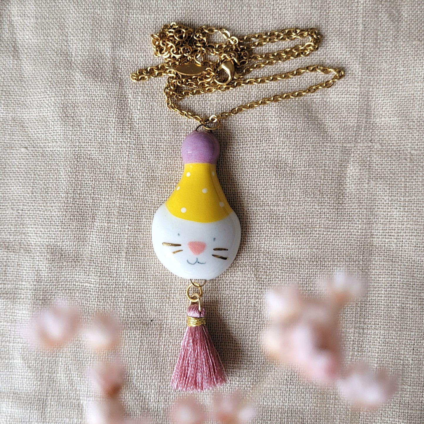 Porcelain necklace with gold "Big party kitty with yellow hat"