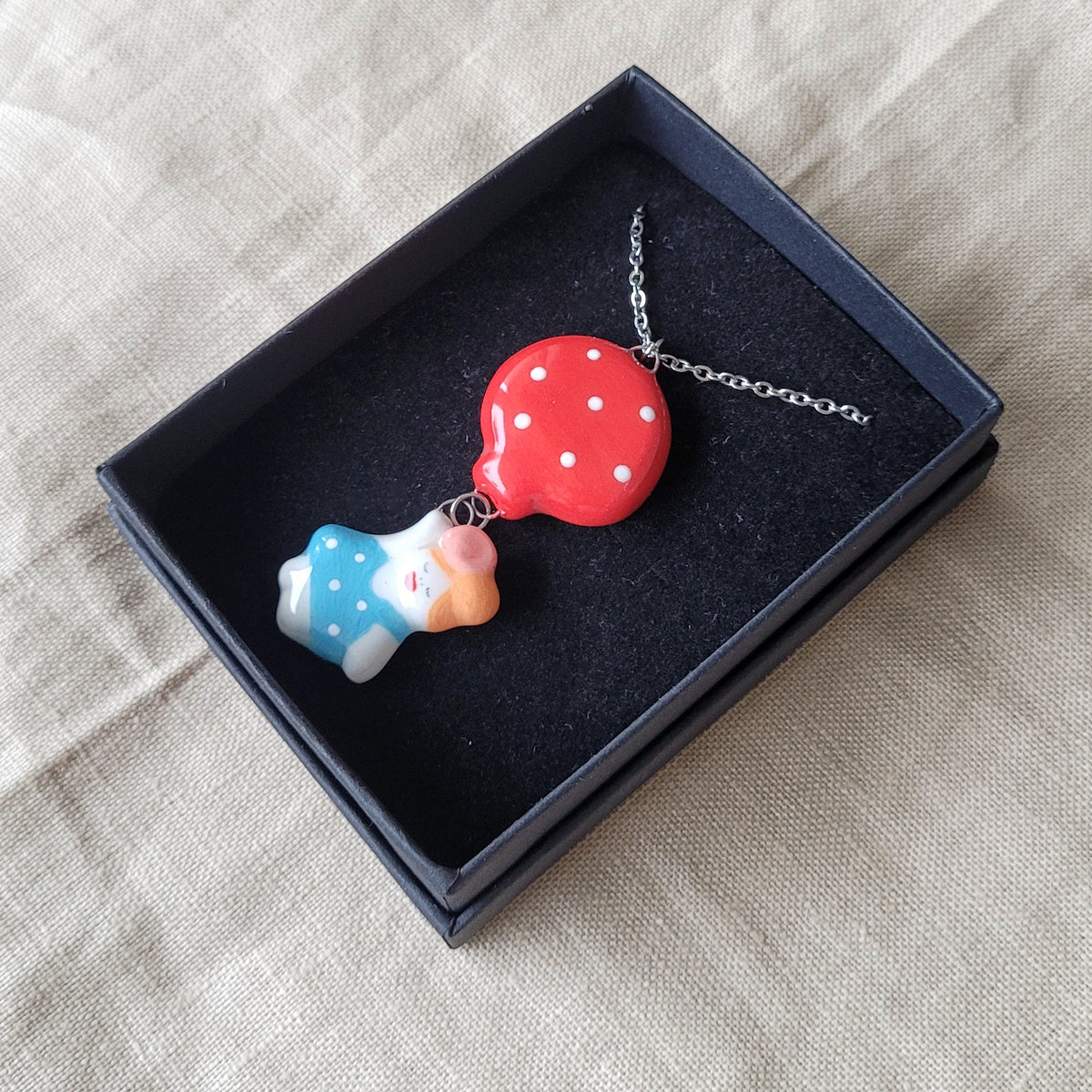 Porcelain necklace "Girl with red balloon"