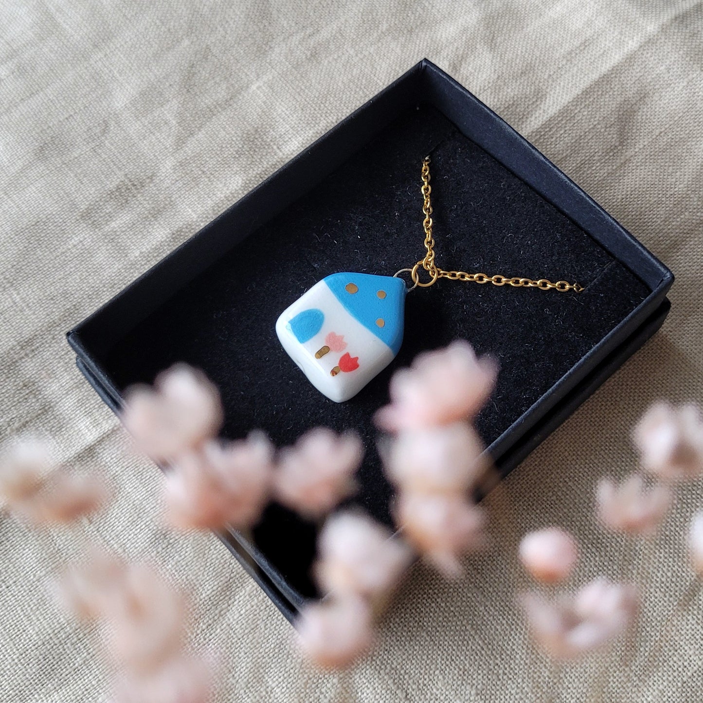 Porcelain necklace with gold "Blue house"