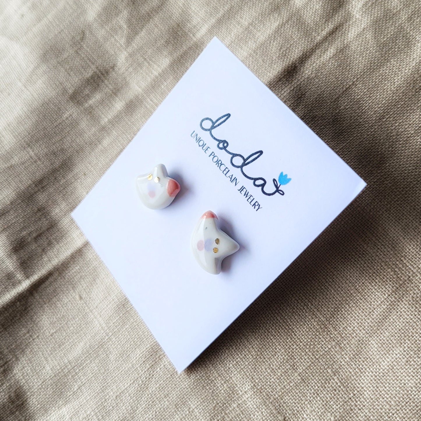 Porcelain stud earrings with gold "Tiny birds with purple and pink wings"