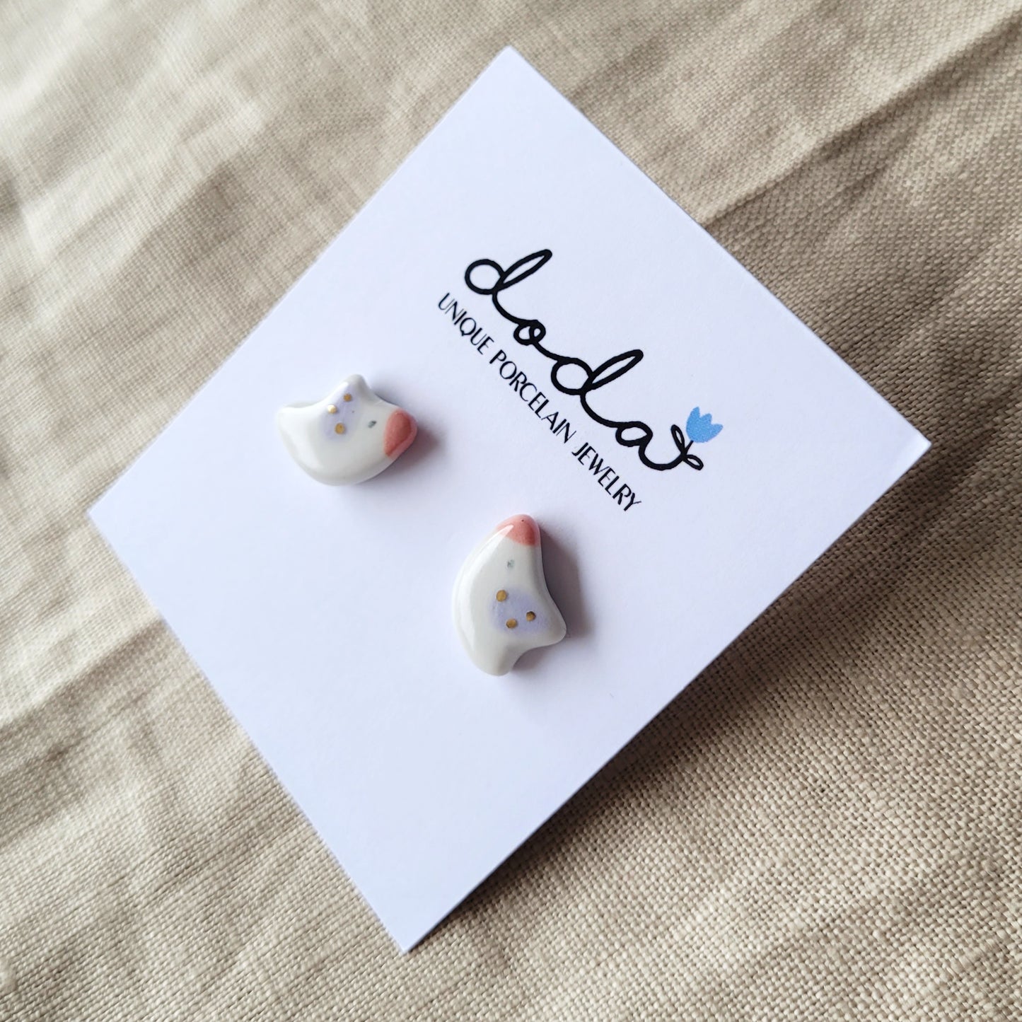Porcelain stud earrings with gold "Tiny birds with purple wings"
