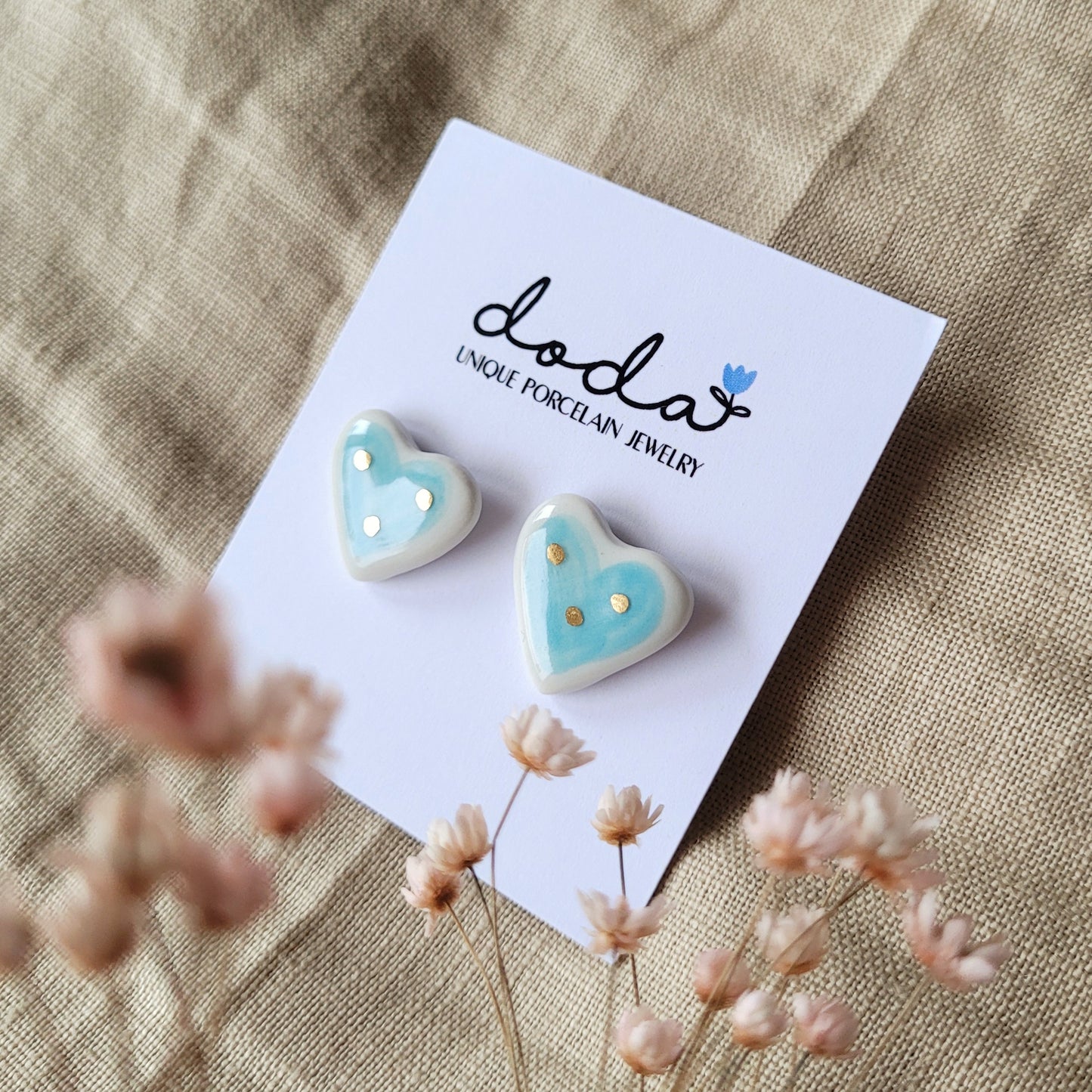 Porcelain stud earrings with gold "White and light blue hearts"