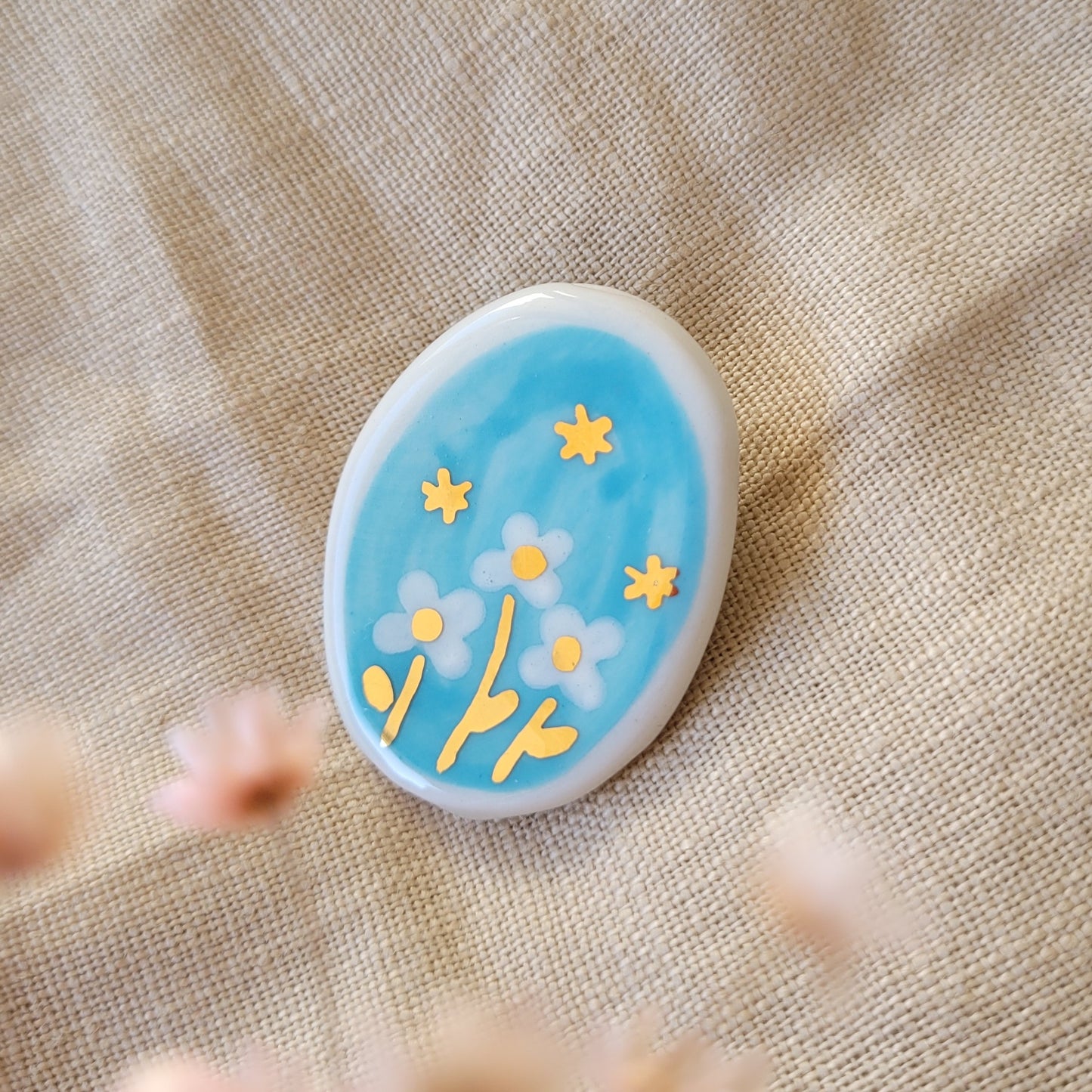 Porcelain brooch with gold "Stars"