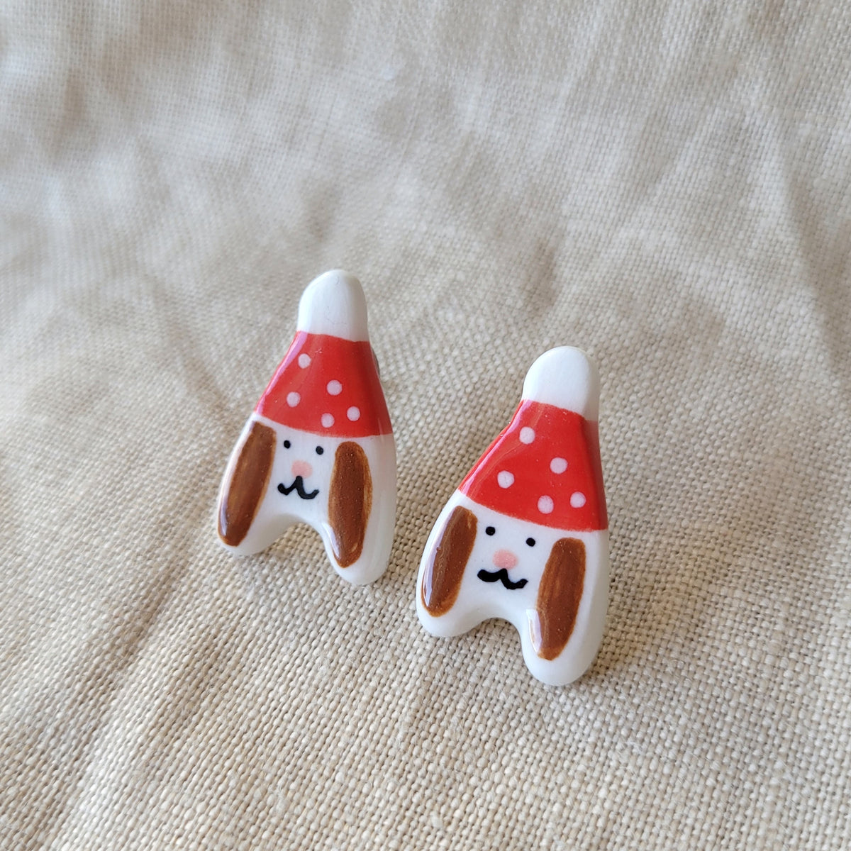 Porcelain stud earrings "Puppies with red hats"
