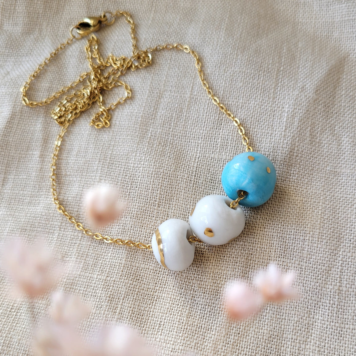 Porcelain necklace with gold "White, blue and gold"