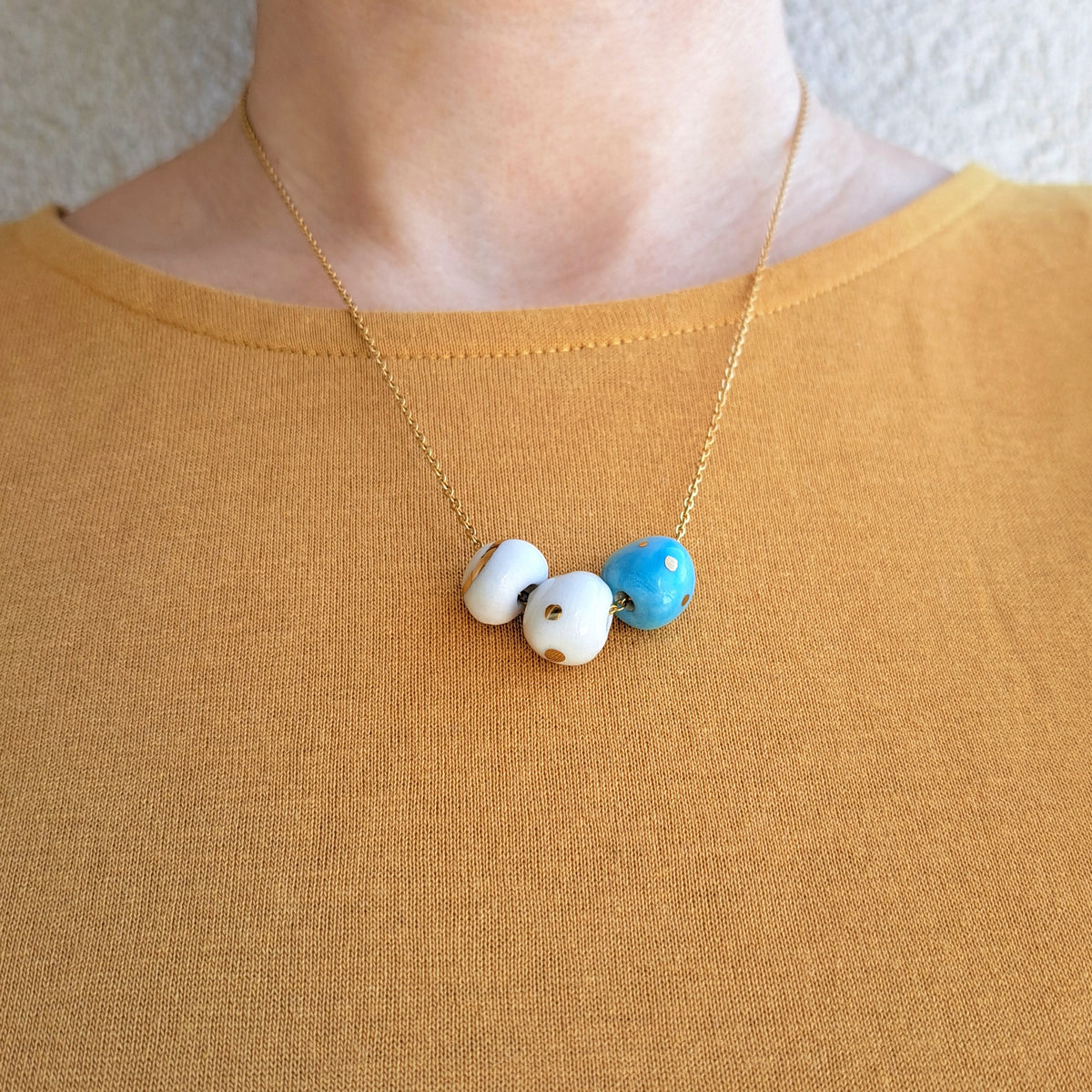 Porcelain necklace with gold "White, blue and gold"
