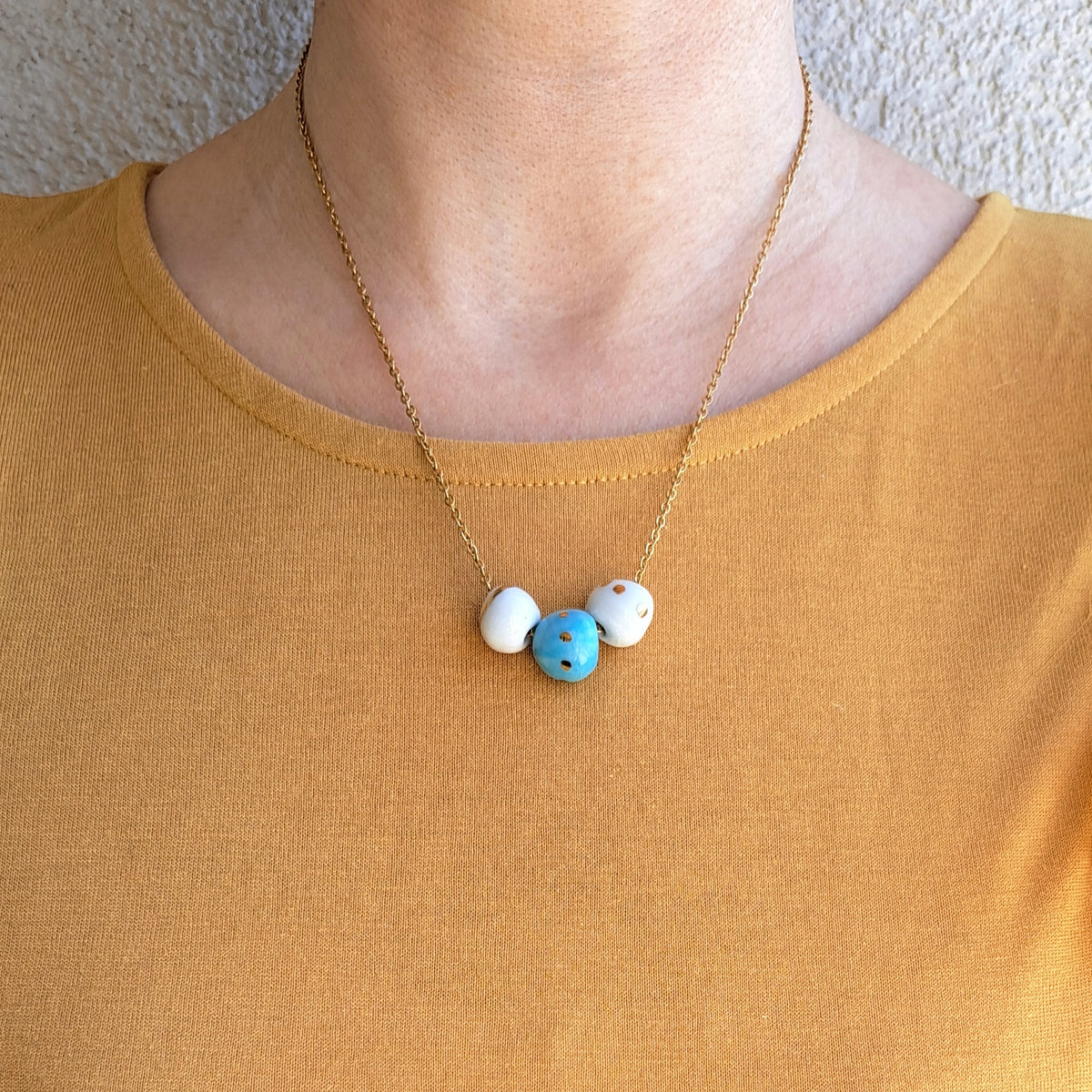 Porcelain necklace with gold "White, gold and blue"