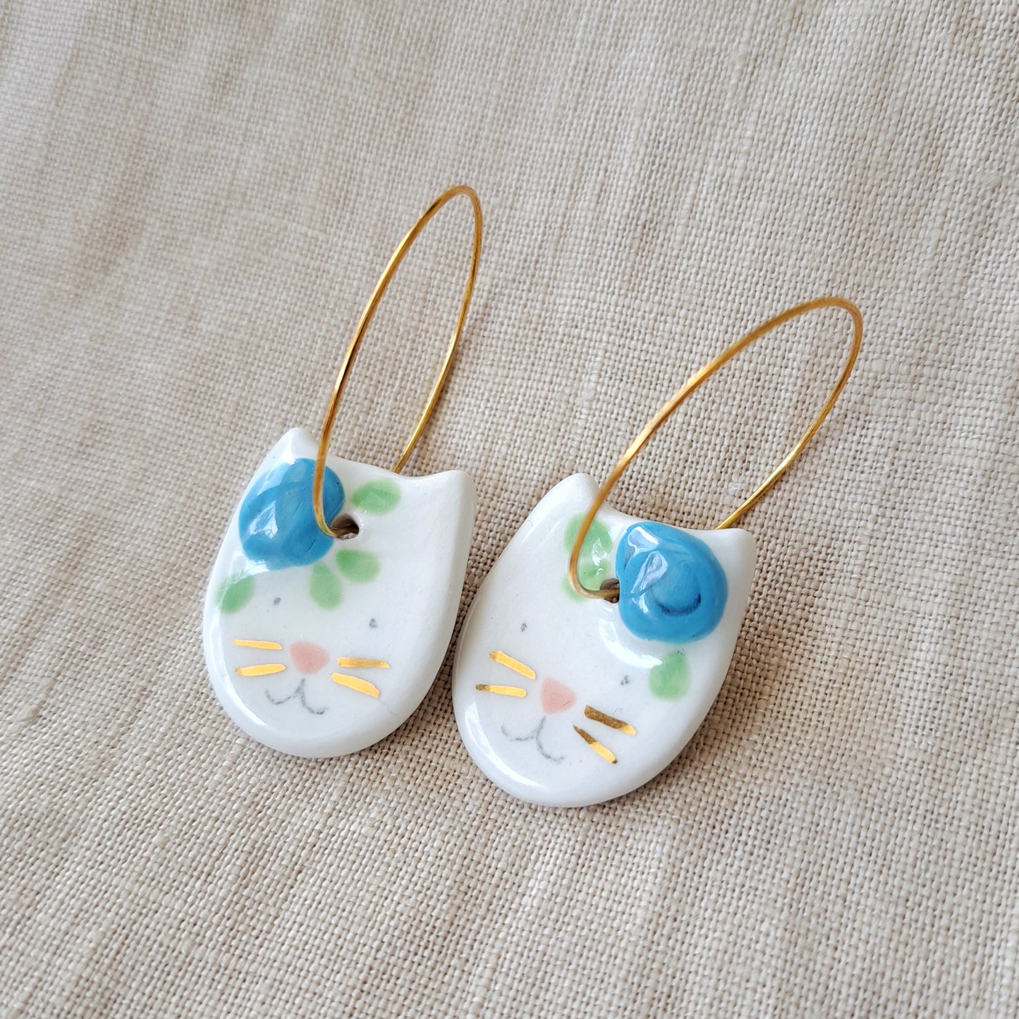 Porcelain dangle earrings with gold "Cats with blue flowers"
