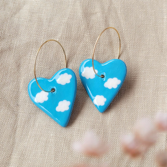 Ceramic dangle earrings "Blue hearts with white clouds"